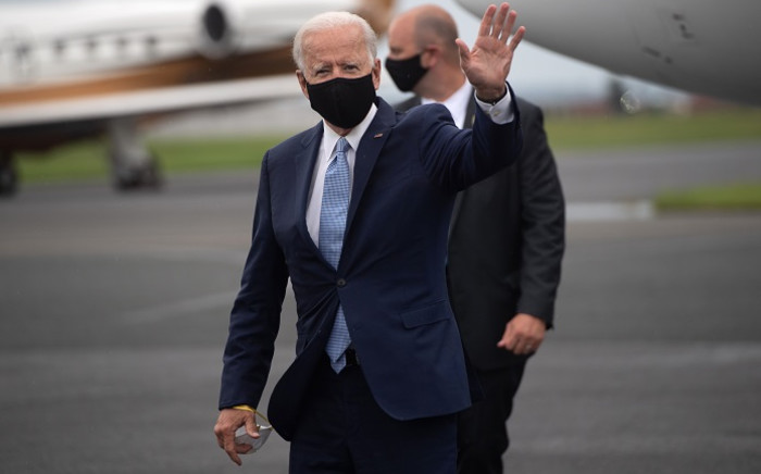 Democratic presidential nominee former US Vice President Joe Biden waves as he disembarks from an airplane at New Castle Airport in New Castle, Delaware,  31 August 2020, following travel to Pennsylvania for campaign events. Picture: AFP.
