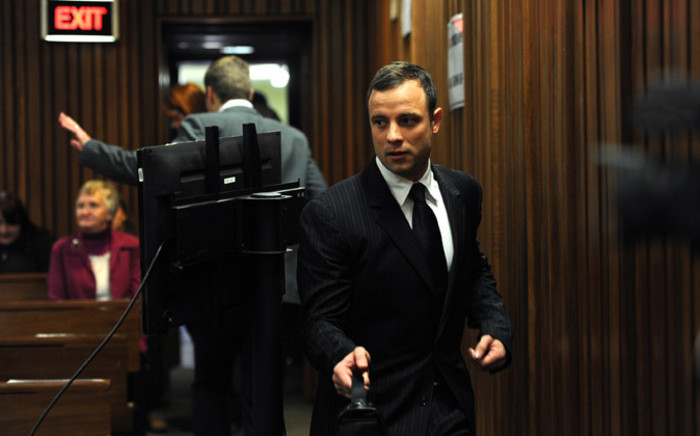 Murder-accused Oscar Pistorius arrives at the High Court in Pretoria for his trial on 2 July 2014. Picture: Pool.