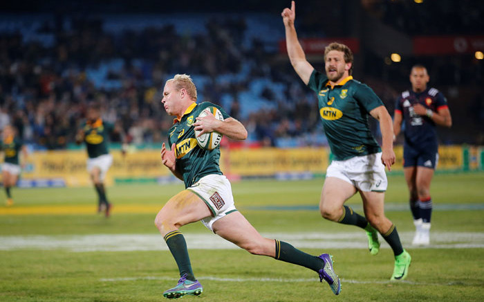 FILE: Springbok scrumhalf Ross Cronje runs in to score a try. Picture: AFP