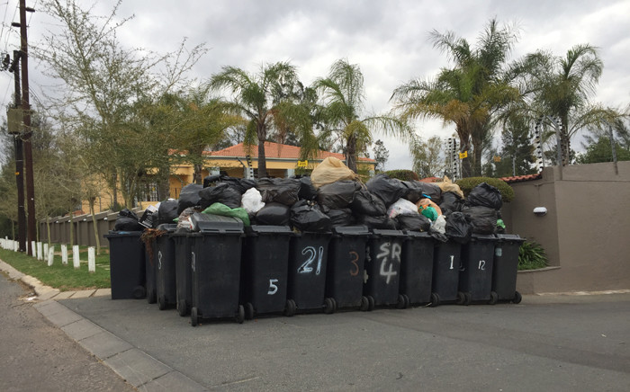 Pikitup workers have been striking in Johannesburg CBD this week emptying trash in the streets and not collecting refuse in Johannesburg. Picture: Tara Meaney/EWN."
