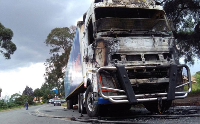 The fruit and vegetable truck was first looted and then set on fire on main reef road in Roodepoort. Picture: Victor Magwedze/EWN