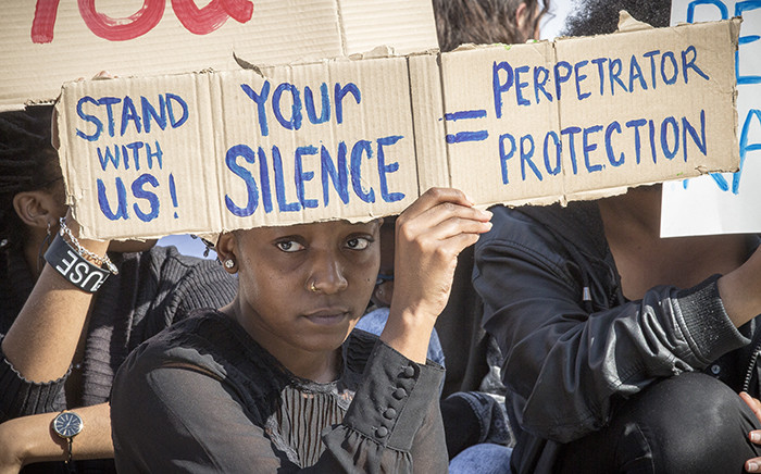 A UCT student holds up a poster during a protest against rape and sexual abuse on campus on 11 May 2016. Picture: Thomas Holder/EWN