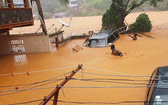 This handout picture released on 14 August 2017, by Society 4 Climate Chnage Communication Sierra Leone, shows flooded streets in Regent near Freetown. Picture: AFP.