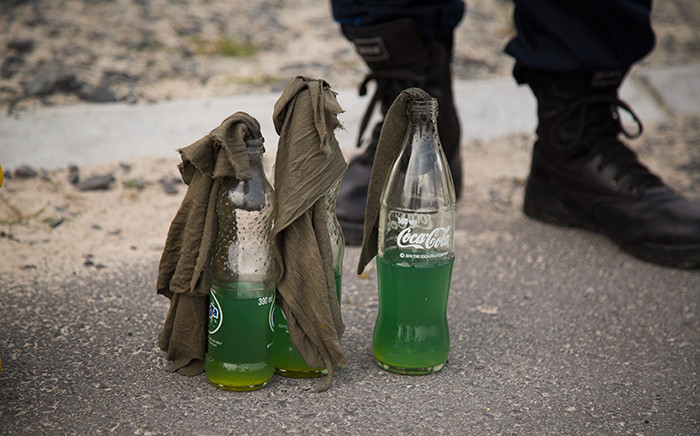 Petrol bombs were confiscated at the illegal housing settlement in Mfuleni. Picture: Anthony Molyneaux/EWN