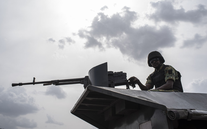 FILE: In this file photo taken on 17 April 2018 a member of the Nigerian Military Police sits on an armoured vehicle during the African Land Forces Summit (ALFS) military demonstration held at General Ao Azazi barracks in Gwagwalada. Picture: AFP.