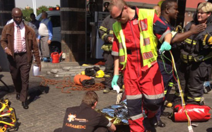 Paramedics on the scene at a filling station in Boksburg where two men who fell into a petrol tank in October. Picture: Christa Van der Walt/EWN