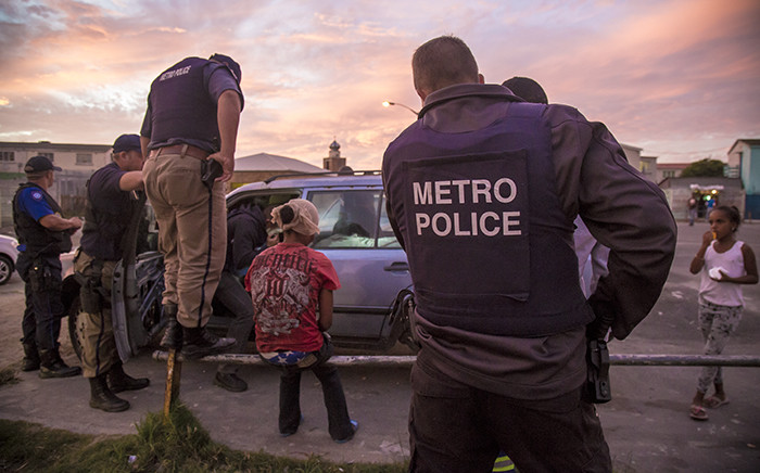 Members of Cape Town's Gang and Drug Taskforce stop and search suspects in Manenberg. Picture: Thomas Holder/EWN.