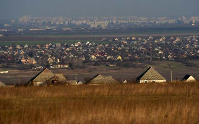 Roofs of Varnita village are seen backdropped by the view of Tiraspol, the main city of self-proclaimed Republic of Transdniestr on March 21, 2014. Moldova, another former Soviet country with a restive Russian-speaking minority, fears events in Ukraine will provide a blueprint for its own separatists, but locals are more concerned about their disastrous economy. Picture: AFP.