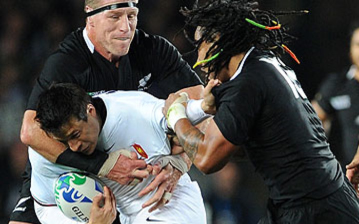 France's Francois Trinh-Duc (C) is tackled by New Zealand All Blacks lock Brad Thorn (L) and center Ma'a Nonu during the 2011 Rugby World Cup final match in Eden Park. Picture: AFP