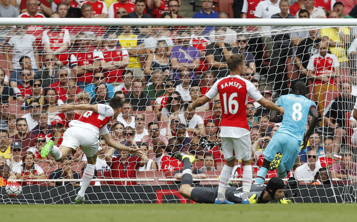 West Ham United's Senegalese midfielder Cheikhou Kouyate (2R) scores the opening goal during the English Premier League football match between Arsenal and West Ham United at the Emirates Stadium in London on August 9, 2015. Picture: AFP.