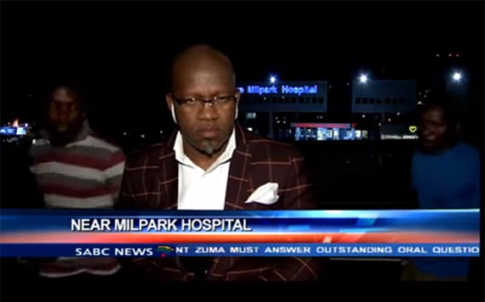 A screengrab shows SABC contributing editor, Vuyo Mvoko, being mugged outside Milpark Hospital in Johannesburg during live recording. 
