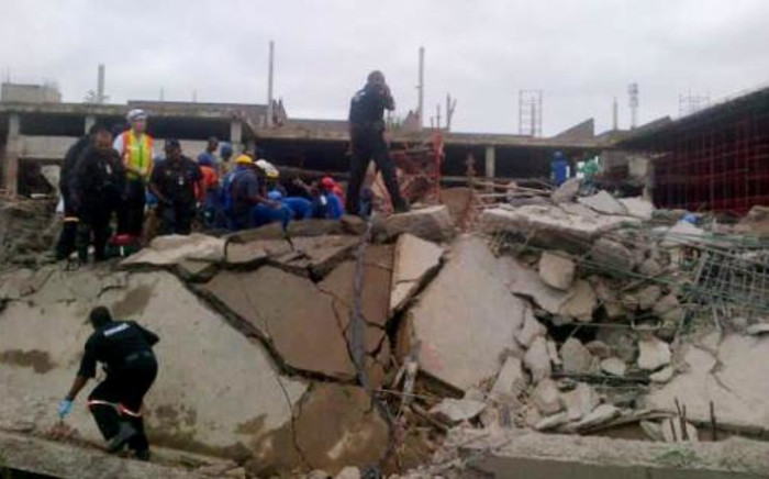 Emergency and construction workers among the rubble at the site of a collapsed mall in Tongaat, KwaZulu-Natal, on 19 November 2013. @Mariolungelo/Twitter.