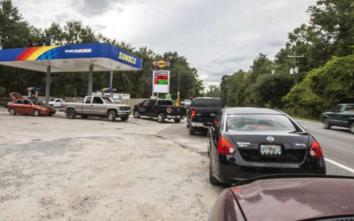People line up for gasoline as Hurricane Michael bears down on the northern Gulf coast of Florida on October 8, 2018 outside Tallahassee, Florida. Picture: AFP.