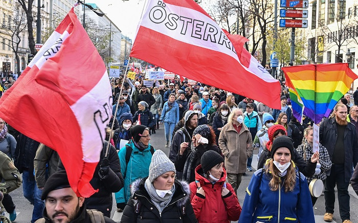 Demonstrators take part in a rally held by Austria's far-right Freedom Party FPOe against the measures taken to curb the coronavirus (Covid-19) pandemic, at Maria Theresien Platz square in Vienna, Austria on November 20, 2021. Picture: Joe Klamar / AFP.
