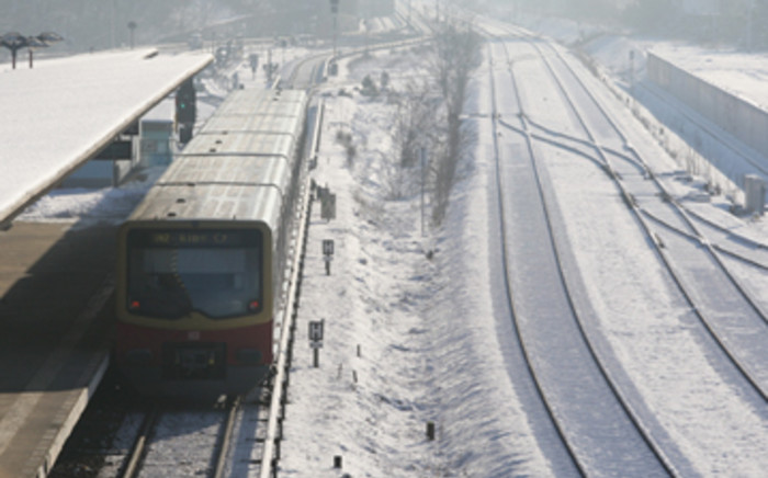 A train pasts snow-covered rails in Berlin, Germany. Picture: Andreas Rentz/Getty Images