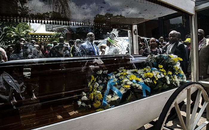 Thoriso Themane’s casket placed in a horse-drawn glass hearse before moving to the cemetery. Picture: Kayleen Morgan/EWN 