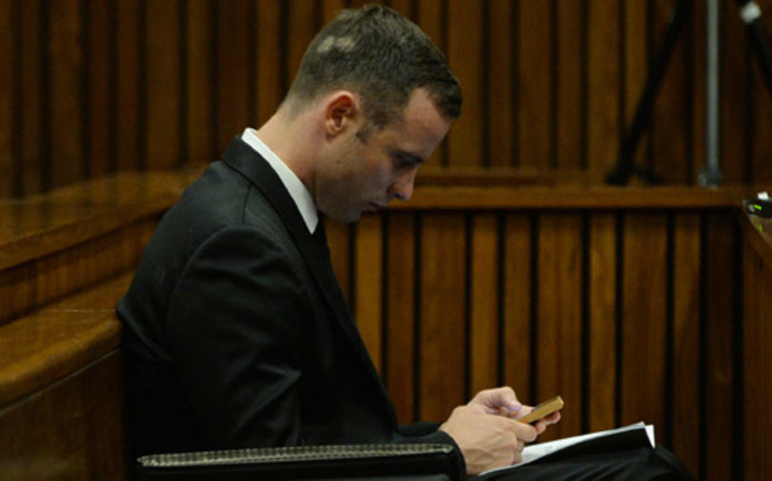 Oscar Pistorius on day 10 of his murder trial at the High Court in Pretoria on 14 March 2014. Picture: Pool.