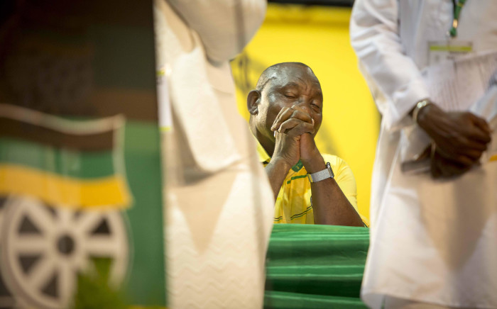 FILE: Cyril Ramaphosa closes his eyes as religious leaders offer prayers to their respective gods at the start of the ANC's 54th national conference on 16 December 2017. Picture: Thomas Holder/EWN