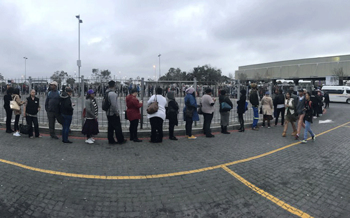Commuters queue for taxis in Mitchells Plain on day one of the bus drivers strike on 18 April 2018. Picture: Cindy Archillies/EWN