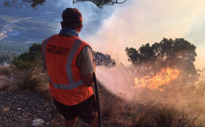A firefighter pictured on scene of a fire that broke out near Du Toitskloof Pass on 2 February 2017. Picture: Kevin Brandt/EWN.