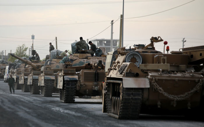 Tanks are pictured lined up as Turkish soldiers and Turkey-backed Syrian fighters deploy near the Turkish village of Akcakale along the border with Syria on 11 October 2019, as they prepare to take part in the Turkish-led assault on northeastern Syria. Picture: AFP