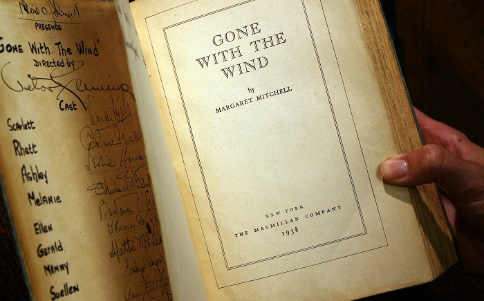 In this file photo a copy of the book "Gone With the Wind" by Margaret Mitchell, signed by producer, director, and most of speaking cast of the 1939 Hollywood film, is pictured 18 October 2007 in Los Angeles. Picture: AFP