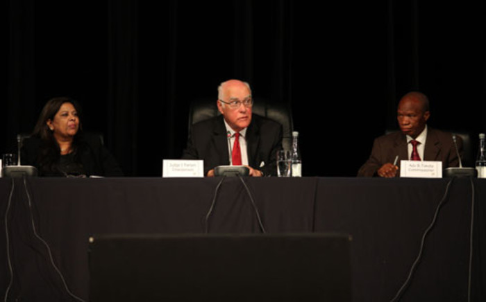 "Retired Judge Ian Farlam and commissioners at the Farlam Commission of Inquiry into the Marikana shooting on 3 October 2012. Picture: Taurai Maduna.