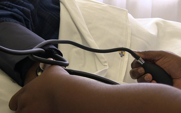 A nurse takes a patient's blood pressure in hospital. Picture: Reinart Toerien/EWN