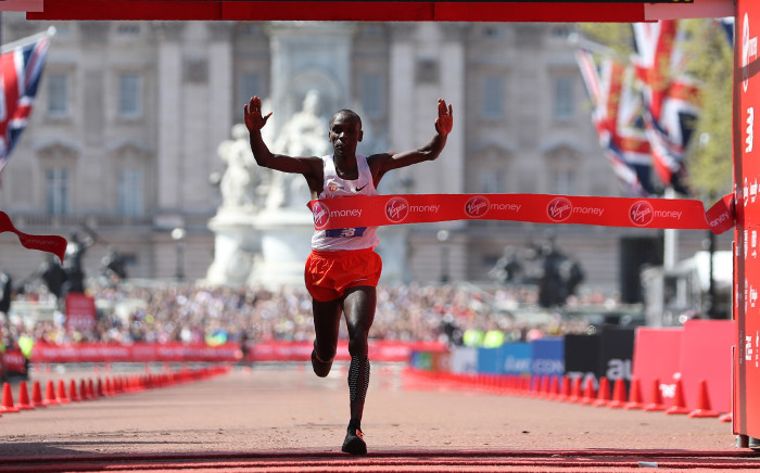 FILE: Kenya's Eliud Kipchoge crosses the finish line to win the elite men's race of the 2018 London Marathon in central London on 22 April 2018. Picture: AFP