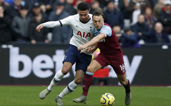 Tottenham Hotspur's English midfielder Dele Alli (L) vies with West Ham United's English midfielder Mark Noble during the English Premier League football match between West Ham United and Tottenham Hotspur at The London Stadium, in east London on 23 November 2019. Picture: AFP.
