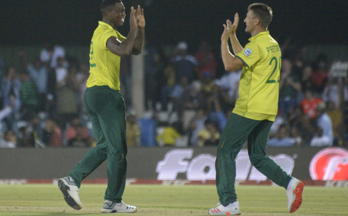 FILE: Lungi Ngidi (L) produced a match-winning performance at the death to help the Proteas defeat England by just one run in the first T20 international at Buffalo Park, East London. Credit: AFP