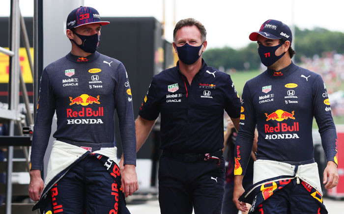 Red Bull's Max Verstappen (left) and Sergio Perez (right) with team principal Christian Horner (centre) at the Hungarian F1 Grand Prix on 1 August 2021. Picture: @redbullracing/Twitter
