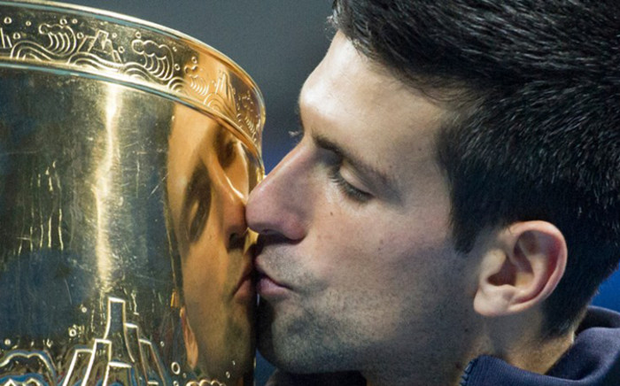 Novak Djokovic of Serbia kisses his trophy after beating Tomas Berdych of the Czech Republic during their men’s singles final at the China Open. Picture: AFP