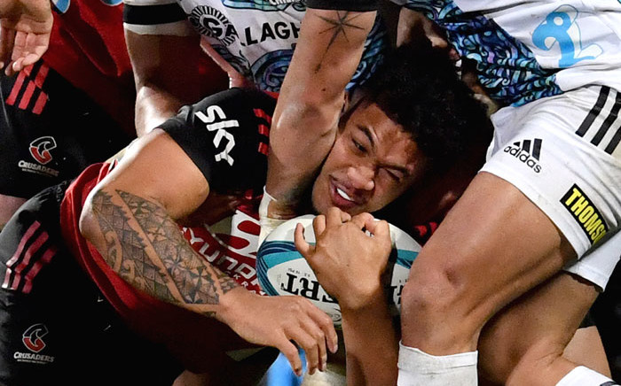 Crusaders’ Leicester Fainga'anuku (C) is tackled during the Super Rugby Pacific semifinal match between the Canterbury Crusaders and Waikato Chiefs at Orangetheory Stadium in Christchurch on 10 June 2022. Picture: Sanka Vidanagama/AFP