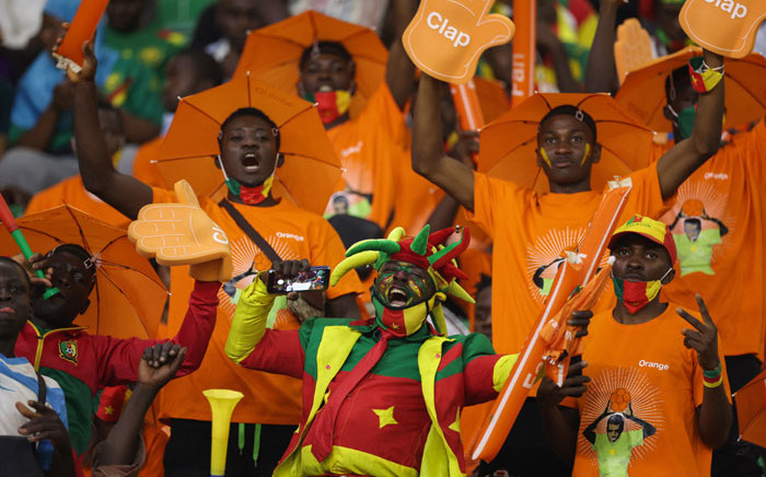 Cameroon supporters cheer ahead of the Africa Cup of Nations (CAN) 2021 round of 16 football match between Cameroon and Comoros at Stade d'Olembe in Yaounde on 24 January 2022. Picture: Kenzo Tribouillard/AFP