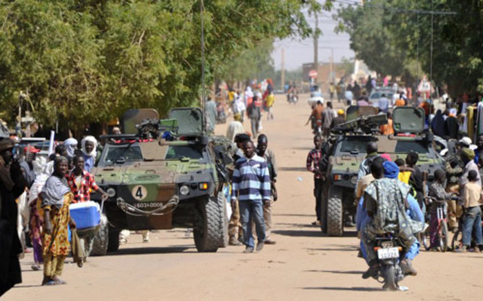 French troops patrol in the streets of Gao on February 3, 2013. France said it carried out major air strikes on the same day near Kidal, the last bastion of armed extremists chased from Mali's desert north in a lightning French-led offensive. Picture: AFP / Sia Kambou