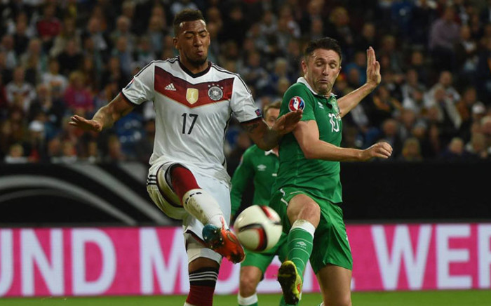 Germany's Jerome Boateng and Ireland's Robbie Keane fight for the ball during the Euro 2016 qualifiers on 14 October 2014. Picture: DFB-Team official Facebook page.