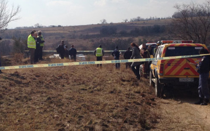 Police and paramedics inspecting the scene where two people were killed in a plane crash near the Lanseria Airport in Johannesburg. Picture: Thando Kubheka/EWN.