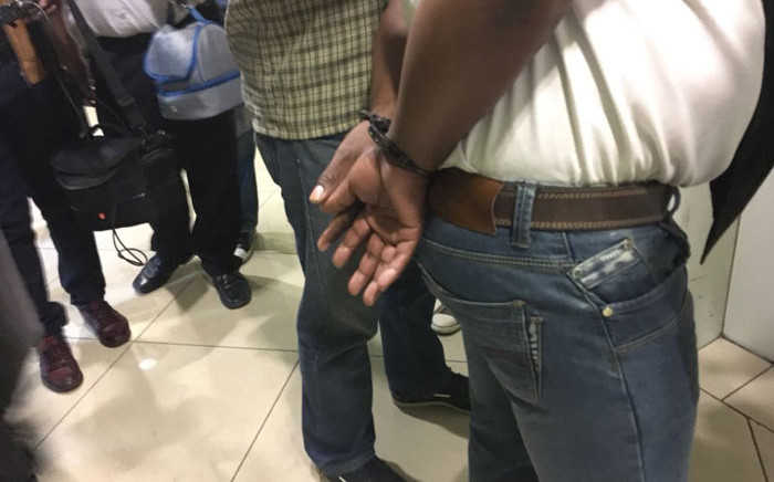 A senior administrative officer employed in the Gauteng Department of Roads and Transport was arrested at his workplace in central Johannesburg on 31 January 2018. Picture: Sethembiso Zulu/EWN