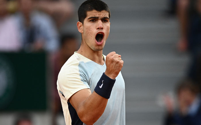 Spain's Carlos Alcaraz reacts as he plays against Spain's Albert Ramos-Vinolas during their men's singles match on day four of the Roland-Garros Open tennis tournament at the Court Simonne-Mathieu in Paris on 25 May 2022. Picture: Christophe ARCHAMBAULT/AFP