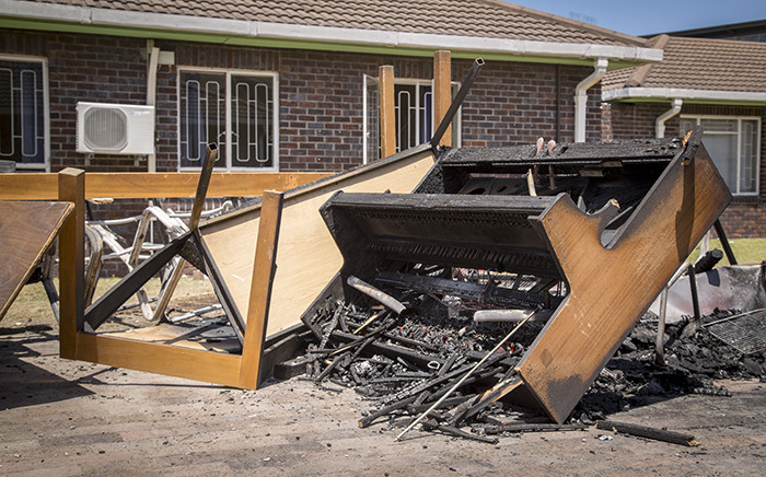 The remains of a piano sit atop a pile of charred furniture outside students' residences at the University of the Western Cape's Bellville campus after protests on Wednesday. Picture: Aletta Harrison/EWN.