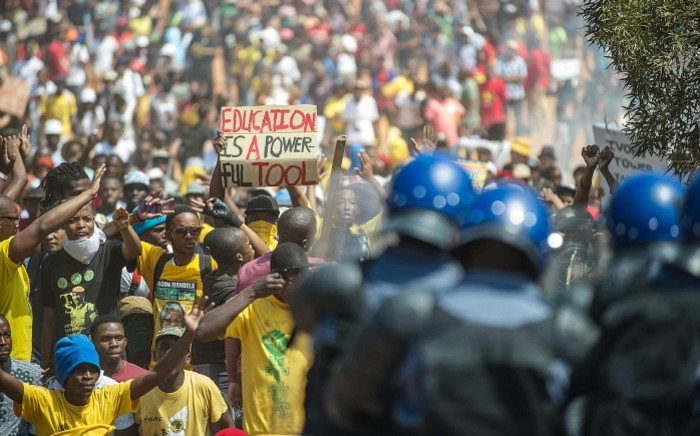 FILE: Police face off against protesting students on the south lawn of the Union Buildings in Pretoria during the Fees Must Fall march on 23 October 2015. Picture: AFP