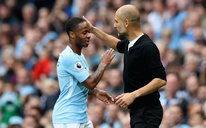 Manchester City’s manager Pep Guardiola congratulates Raheem Sterling on his 51st career goal. Picture: @ManCity/Twitter.

