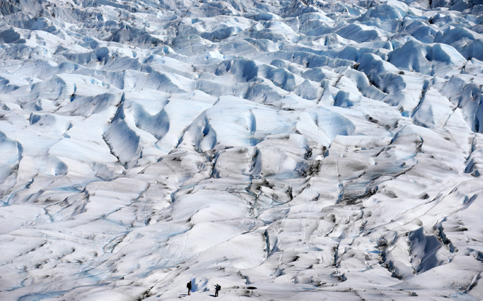 A picture taken on 6 November 2015 shows two soldiers checking a section of the Grey glacier in Torres del Paine National Park, south of Chile. Chilean scientists and members of the countrys armed forces have trained during seven days under extreme conditions in the Grey Glacier before setting out for an expedition to the middle of the ice sheet Antarctica. Picture: EPA/Felipe Trueba.