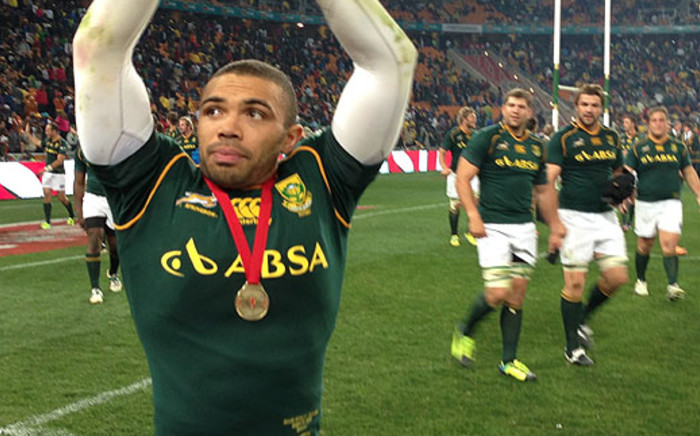 Bryan Habana celebrates with the crowd after the Springboks' record winning performance against Argentina in Johannesburg.