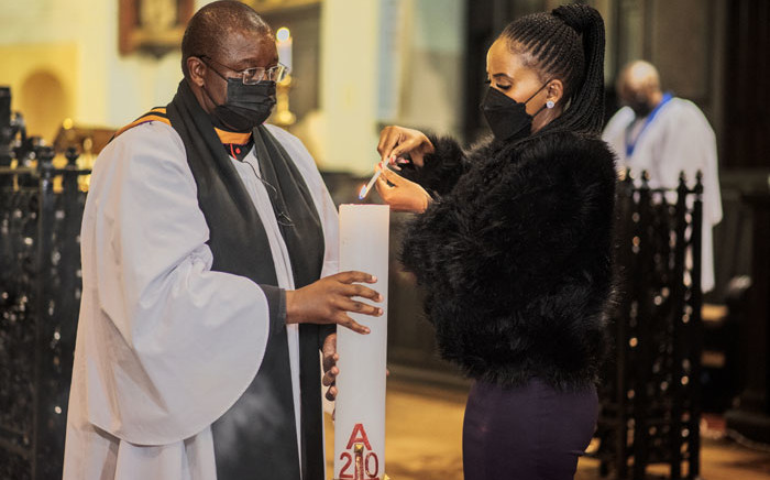 Johannesburg Mayor Mpho Phalatse (R) and an Anglican reverend are seen at a memorial mass in honour of South African anti-apartheid icon Archbishop Emeritus Desmond Tutu at the St. Mary Cathedral in the Johannesburg CBD on 28 December 2021. Picture: LUCA SOLA/AFP