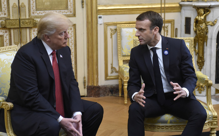 US President Donald Trump (L) speaks with French president Emmanuel Macron prior to their meeting at the Elysee Palace in Paris, on November 10, 2018, on the sidelines of commemorations marking the 100th anniversary of the 11 November 1918 armistice, ending World War I. Picture: AFP.