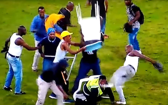 A screengrab of a security guard being attacked by Kaizer Chiefs fans following their defeat to Free State Stars in a Nedbank Cup match at the Moses Mabhida Stadium on 21 April 2018. 
