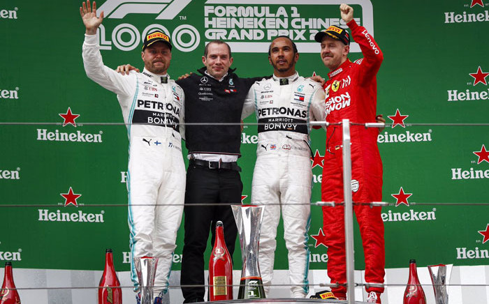 FILE: Mercedes' Valtteri Bottas (left), Lewis Hamilton (centre) and Ferrari's Sebastian Vettel on the podium after the Chinese Grand Prix in Shanghai on 14 April 2019. Picture: @MercedesAMGF1/Twitter