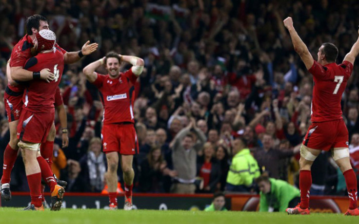 Wales players celebrate at the final whistle in the Autumn International rugby union Test match between Wales and South Africa at the Millennium Stadium in Cardiff, south Wales, on 29 November, 2014. Wales won the game 12-6. Picture: AFP.